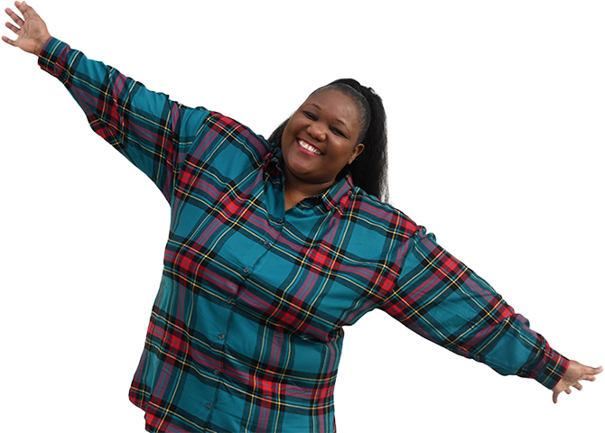 A woman in a tartan shirt, with her arms in the air. She's smiling and represents learners that the SCQF supports