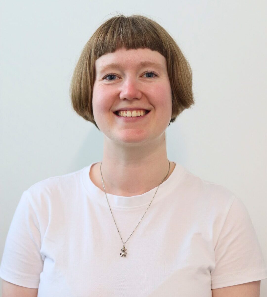Headshot of a smiling Caitlin Walker
