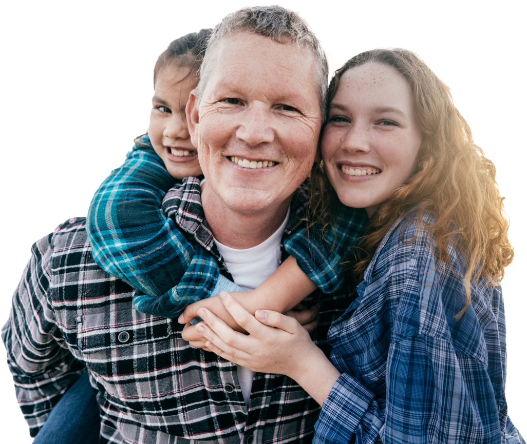 A dad with his two daughters. One is a young girl, and she's being carried on his back, with her arms around his neck. The other daughter is a teenager and she's hugging them both from the side, with her hands touching her sisters. They signify the support the SCQF offers to parents and carers.