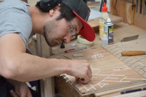 Man building piece of furniture