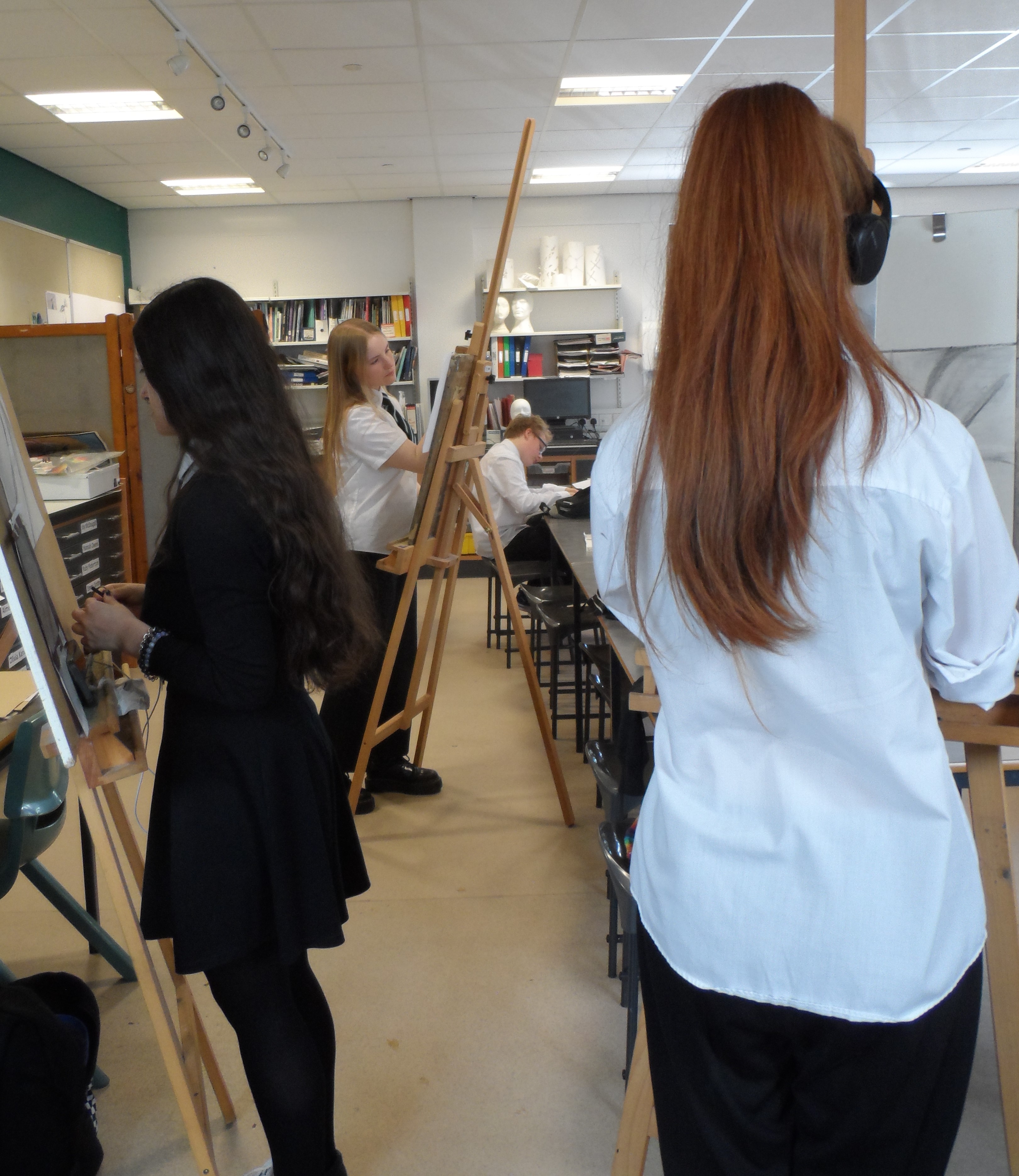 young people drawing in art class