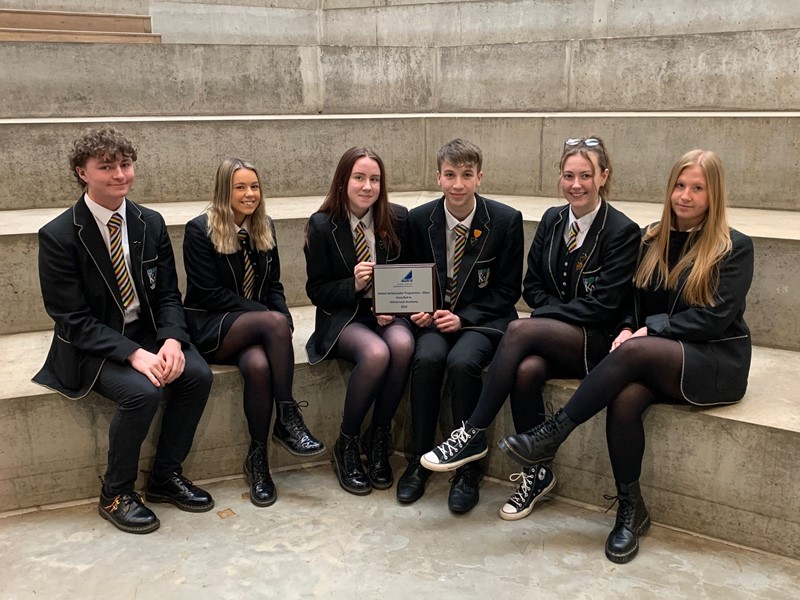 Group of SCQF School Ambassadors at Kilmarnock Academy holding their silver plaque
