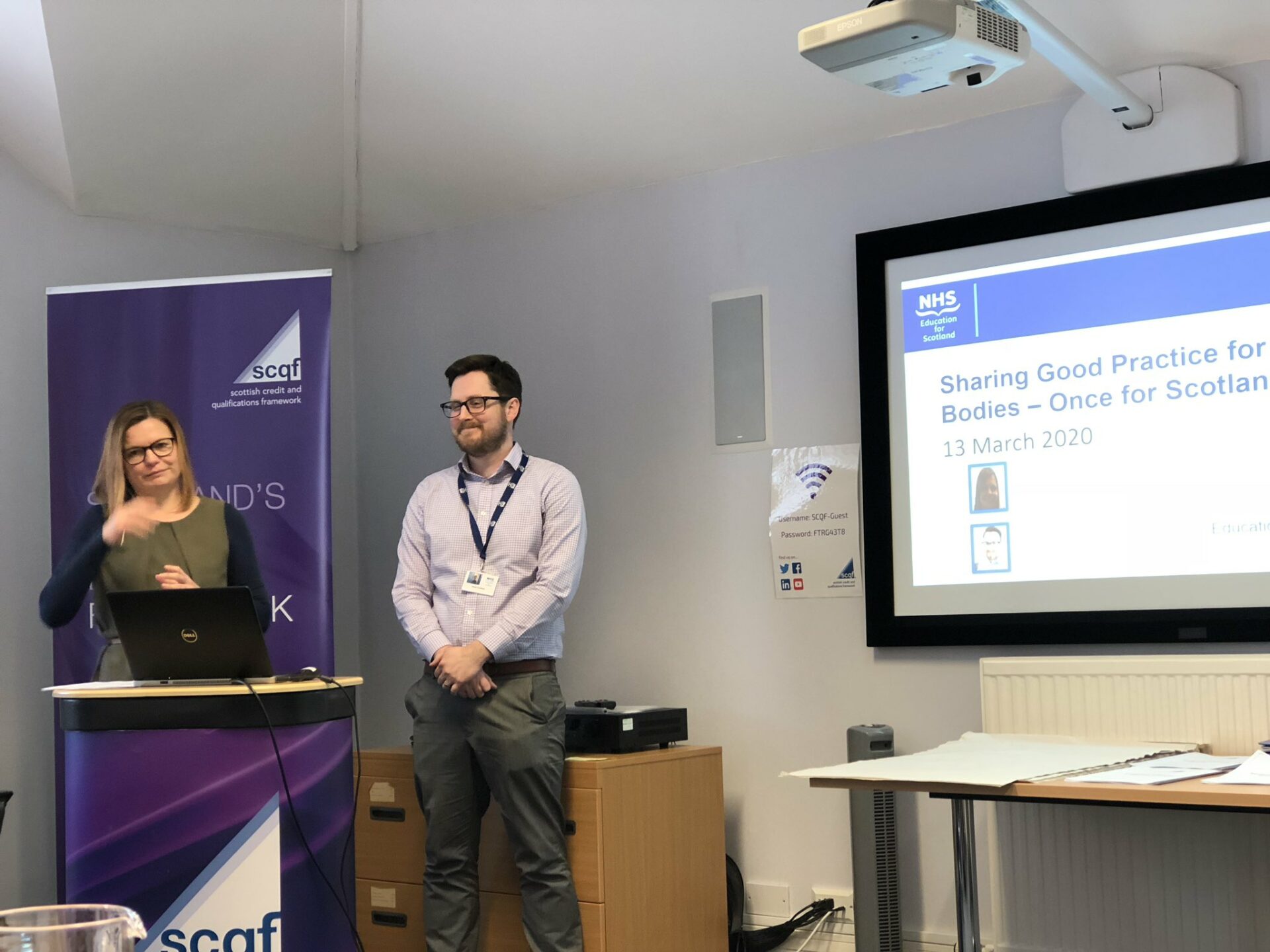 Presenters from NHS Scotland in front of projection screen at SCQF Credit Rating event in March 2020