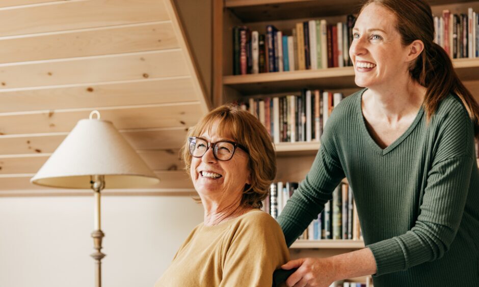 An example of non traditional learning. A woman is pushing an older woman in a wheelchair, showing the caring responsibilities