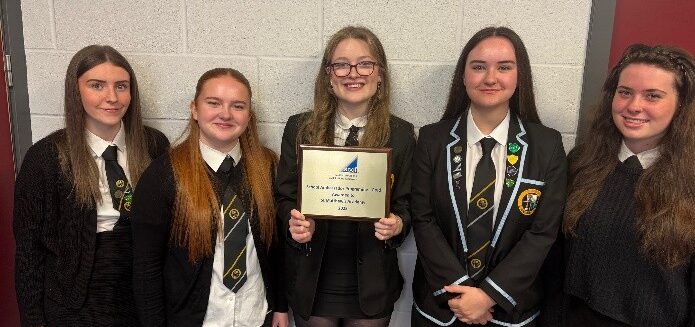 5 female pupils from St Matthew's Academy. The middle pupil is holding up a gold SCQF Ambassador plaque